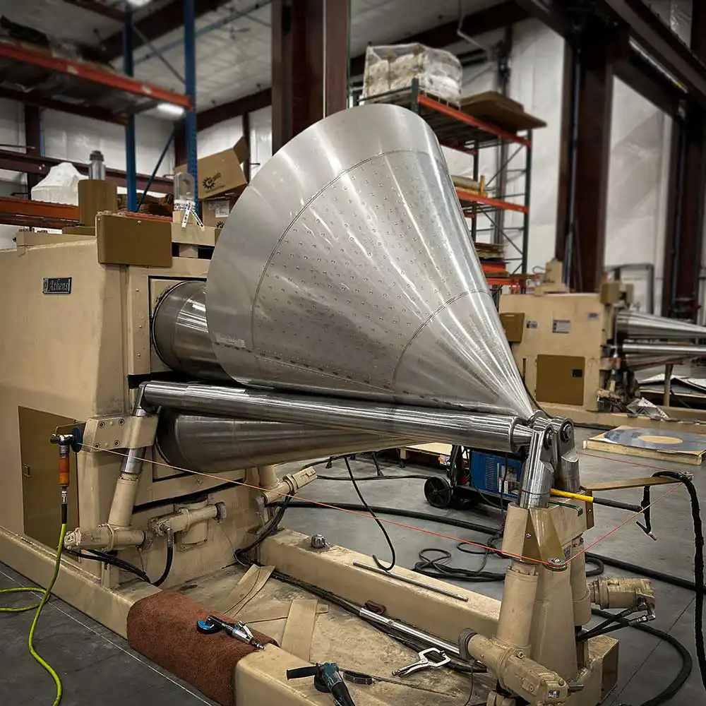 stainless steel cone head or bottom on roller Quality Tank Solutions Marshfield custom stainless steel manufacturing