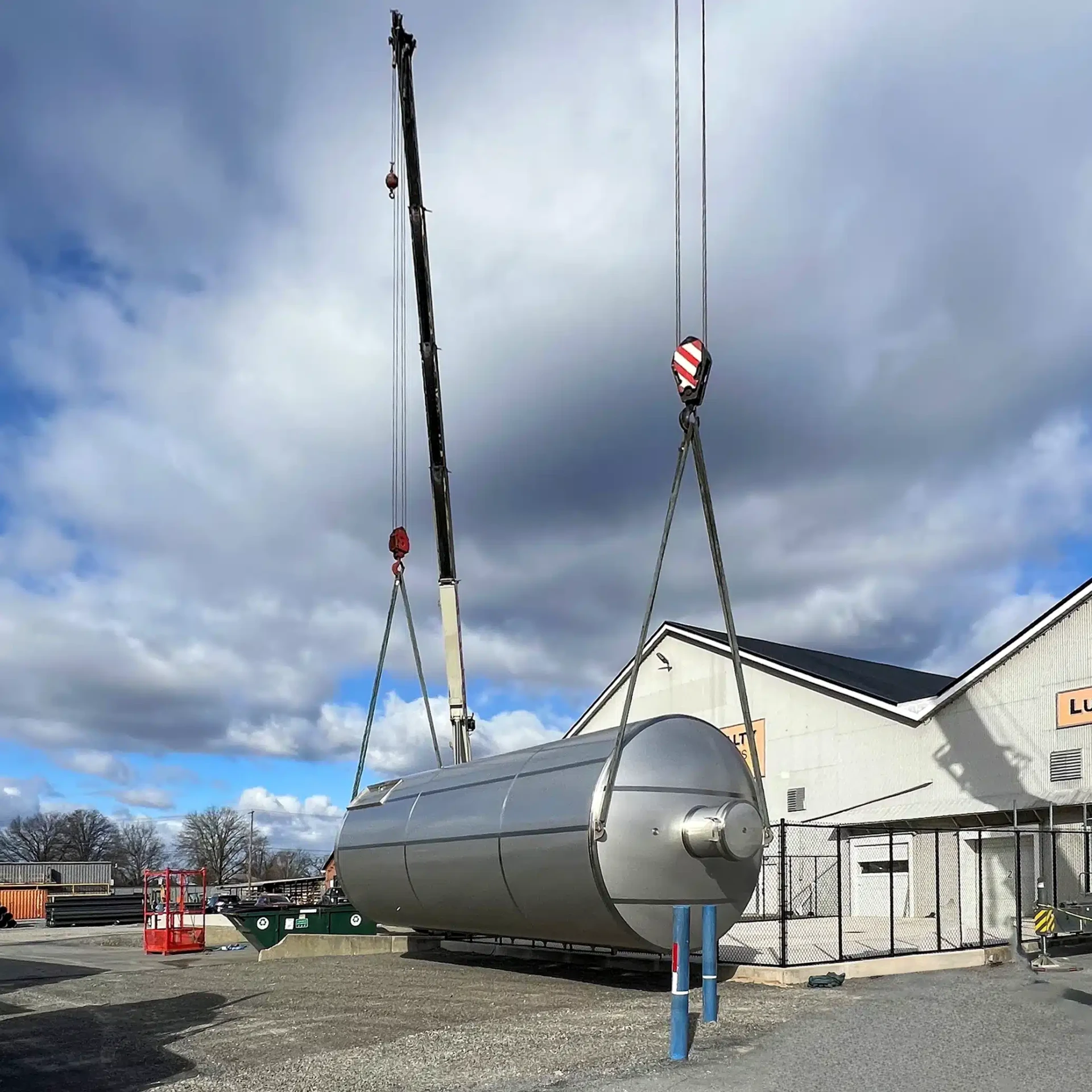 rigging stainless steel storage silo for installation outdoors